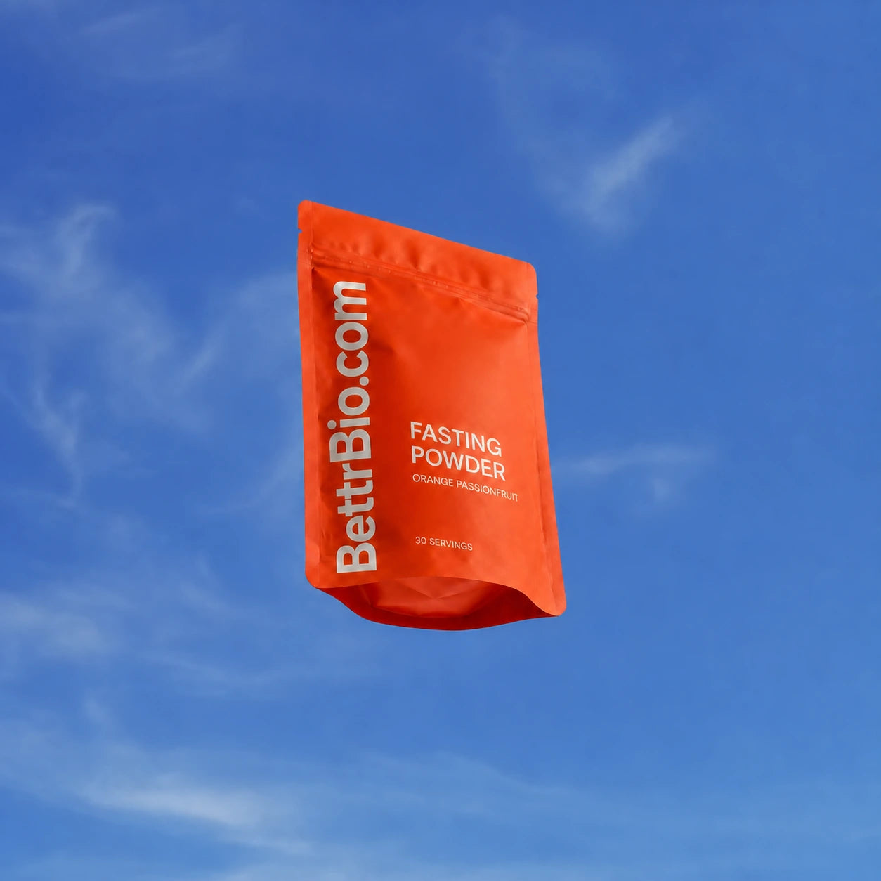 Bettr Bio Fasting Powder pouch floating against a blue sky