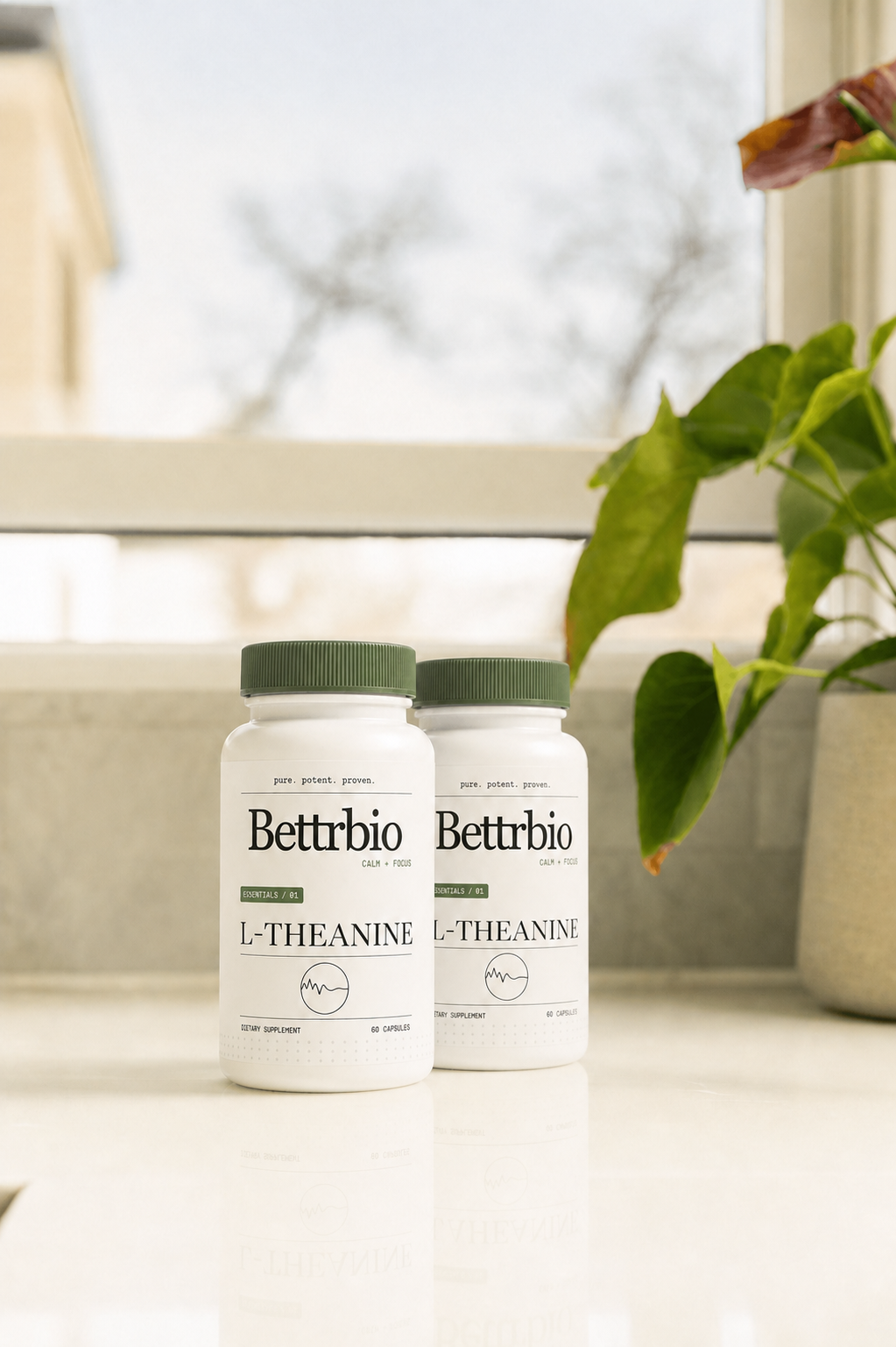 Two Bettrbio L-Theanine bottles on a kitchen counter